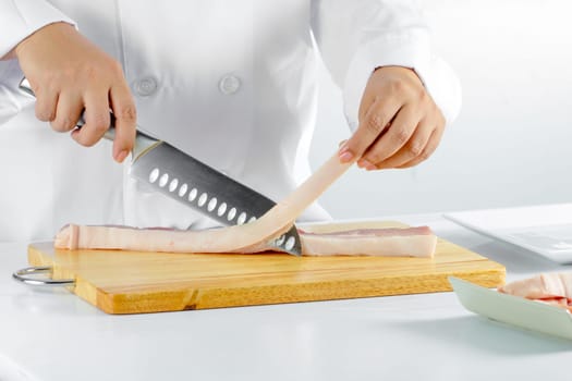chef sliced streaky pork on cutting boards