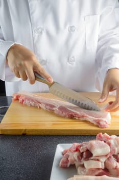 chef sliced streaky pork on cutting boards