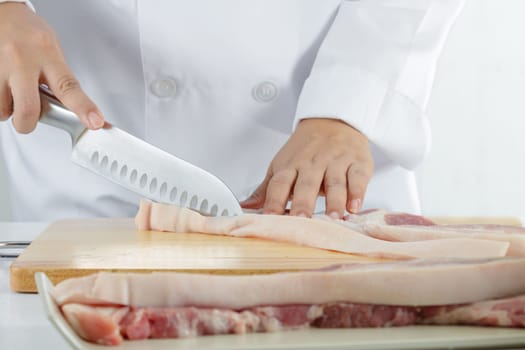 chef sliced streaky pork on cutting boards