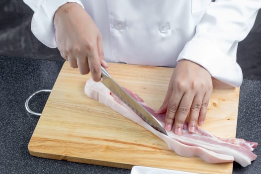 chef sliced streaky pork on cutting boards