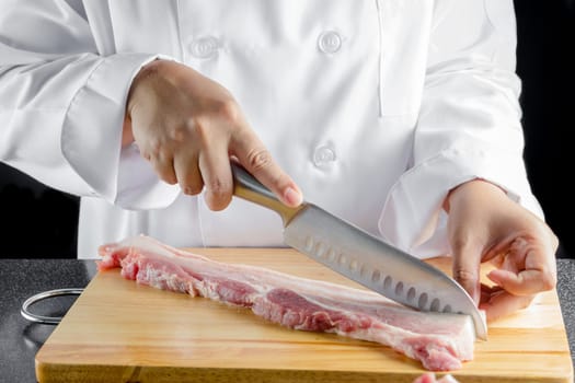 chef sliced streaky pork on cutting boards