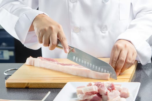chef sliced streaky pork on cutting boards