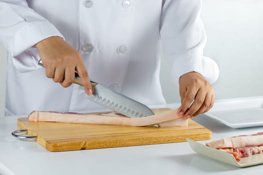chef sliced streaky pork on cutting boards