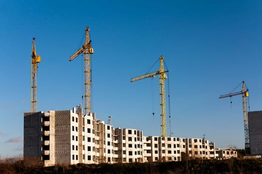 a construction site on which construction of a new multystoried house is carried out.