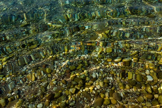 sea pebbles at the beach. Filmed close up .
