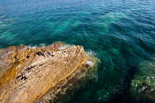 rocky shore into the sea. close up