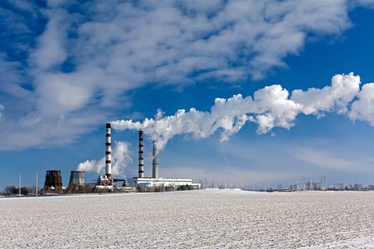 emissions of industrial enterprises in the frosty winter day.
