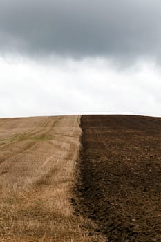 an agricultural field which starts being prepared for a new season. the plowed field. fall