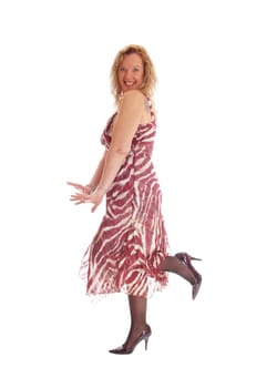 A profile image of a happy blond woman standing in profile, dancing and.smiling, isolated for white background..