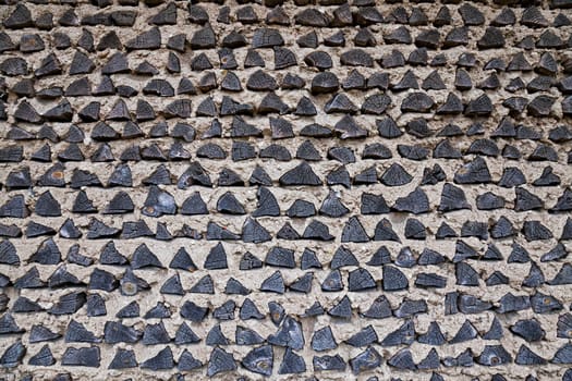 the building wall which is partially made of wooden logs