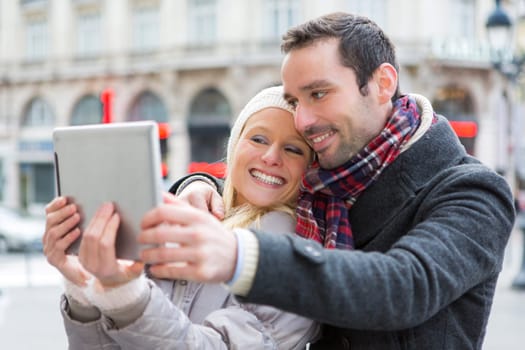 View of a Young couple on holidays taking selfie