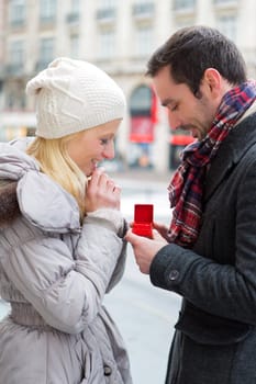 View of a Young attractive man propose marriage to his love
