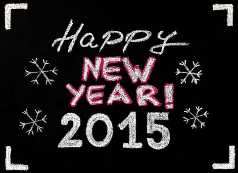 Happy new year 2015, hand writing with chalk on blackboard, vintage concept