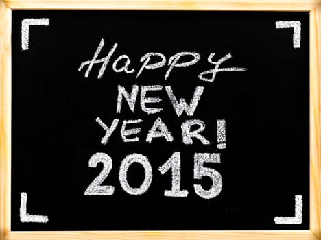 Happy new year 2015, hand writing with chalk on wooden frame blackboard, vintage concept