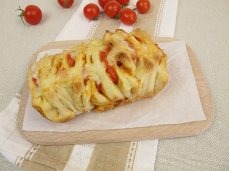 Pizza plucked bread with tomatoes and cheese