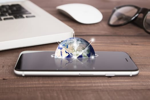 earth on phone screen network concept elements of this image furnished by nasa