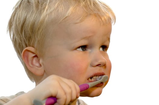 Three year old brushing his teeth
