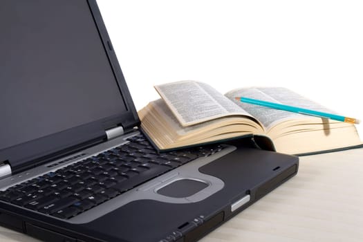 Taking notes on a laptop while translating a book. Book is a dictionary, so no copyright problems.