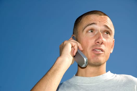 Boy on the phone looking surprised