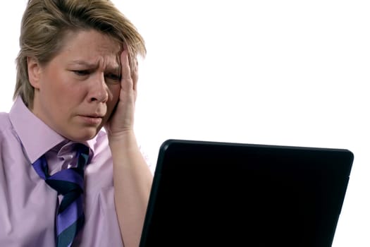 A businesswoman is having a hard day behind her laptop.