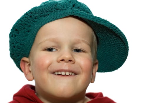Cute picture of a little 3 year old wearing a green hat.