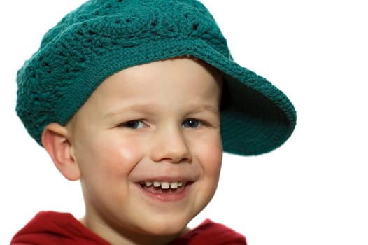 Cute picture of a little 3 year old wearing a green hat.