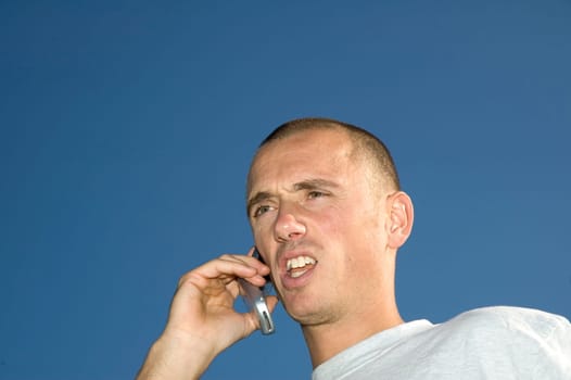 Boy on the phone,looking surprised