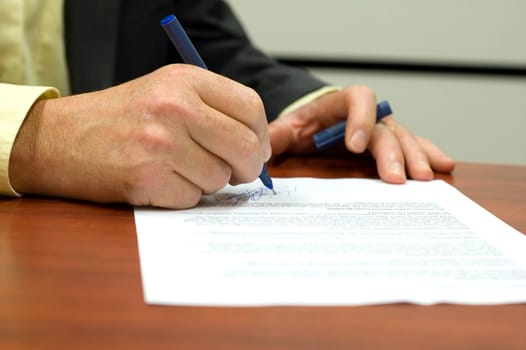 Business man signing a contract