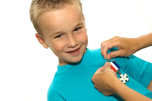 This boy is very happy, he has won a third price for the first time in his life.