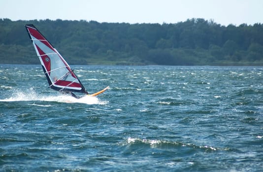 Windsurfing in the Dutch waters. Moving fast, windspeed 10.