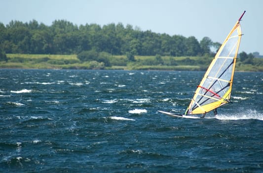 Windsurfing in the Dutch waters. Moving fast, windspeed 10.