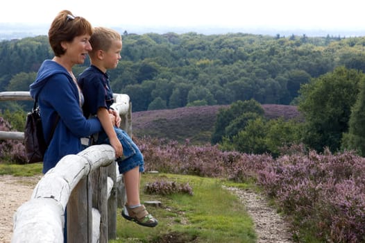 Grandma and grandson looking at a beautiful landscape.