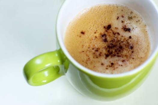 A delicous cup of cappuchino from above.