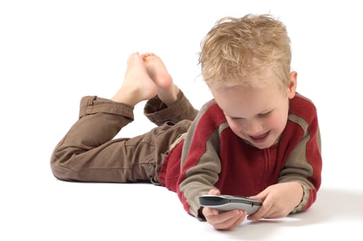 Little boy on the phone, calling his grandpa. Isolated on white.
