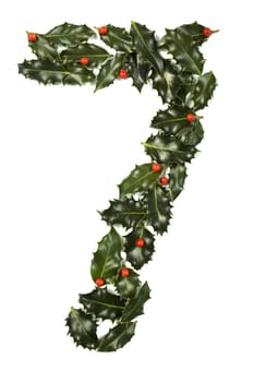Holly Leaves with berry's in the form of the digit seven. Isolated on white.