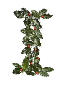 Holly Leaves with berry's in the form of the letter I. Isolated on white.