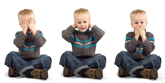 Young boy playing don't see, don't hear, don't speak.