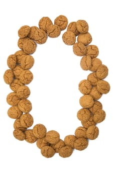 Little ginger nuts in the form of the digit zero. These little ginger nuts are used in Holland for the "Sinterklaas"" party, which is at Dec 5 every year. Sinterklaas is a sort of Santa Claus. In Holland these ginger nuts are called ""pepernoot"". Isolated on white."