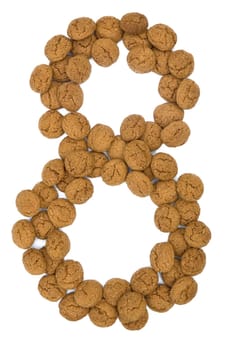 Little ginger nuts in the form of the digit eight. These little ginger nuts are used in Holland for the "Sinterklaas"" party, which is at Dec 5 every year. Sinterklaas is a sort of Santa Claus. In Holland these ginger nuts are called ""pepernoot"". Isolated on white."