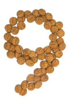 Little ginger nuts in the form of the digit nine. These little ginger nuts are used in Holland for the "Sinterklaas"" party, which is at Dec 5 every year. Sinterklaas is a sort of Santa Claus. In Holland these ginger nuts are called ""pepernoot"". Isolated on white."