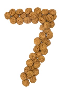 Little ginger nuts in the form of the digit seven. These little ginger nuts are used in Holland for the "Sinterklaas"" party, which is at Dec 5 every year. Sinterklaas is a sort of Santa Claus. In Holland these ginger nuts are called ""pepernoot"". Isolated on white."