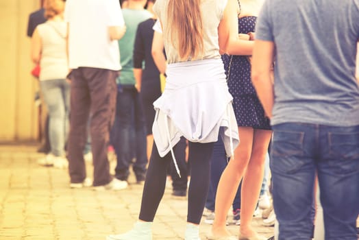 long queue of people,vintage effect