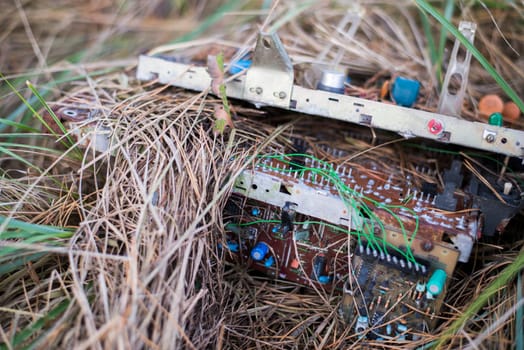 electronic waste on grass