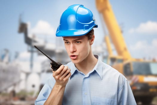 Young student learning to communicate and make decisions on construction site