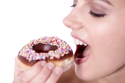 Cropped image of a woman about to eat a donut over white
