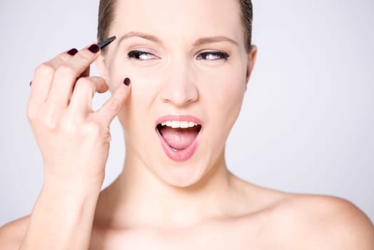 Makeup lady doing her eyebrows