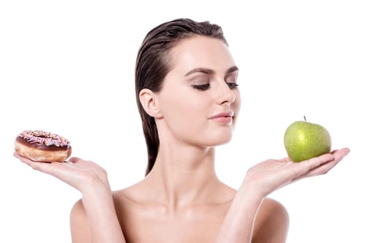 Young woman holding nutritious foods over white