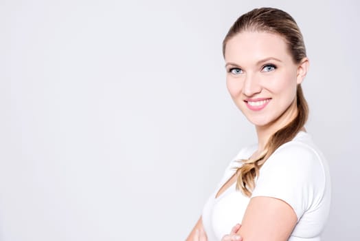 Attractive woman isolated against grey background