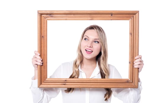 Woman holding wooden frame and looking away