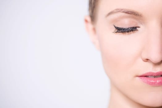 Makeup woman, face closeup. Copy space area.